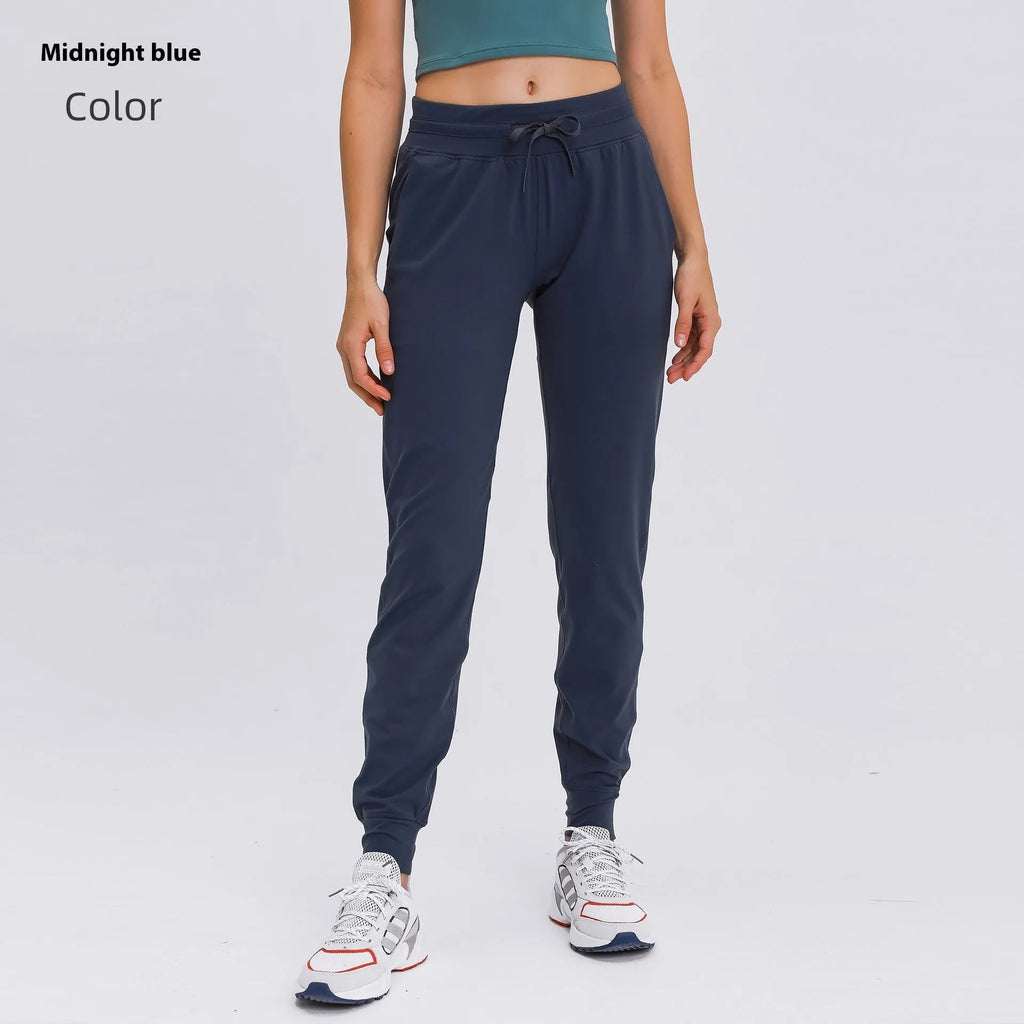 Women's high waist yoga pants with drawstring waistband in blue, shown for fitness use.