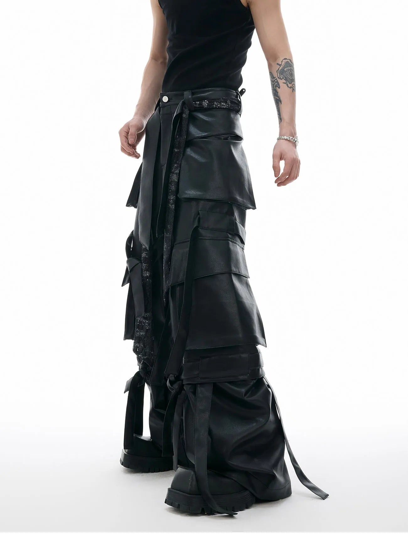 Black loose fit leather pants with multiple pockets and quilted stitching detail