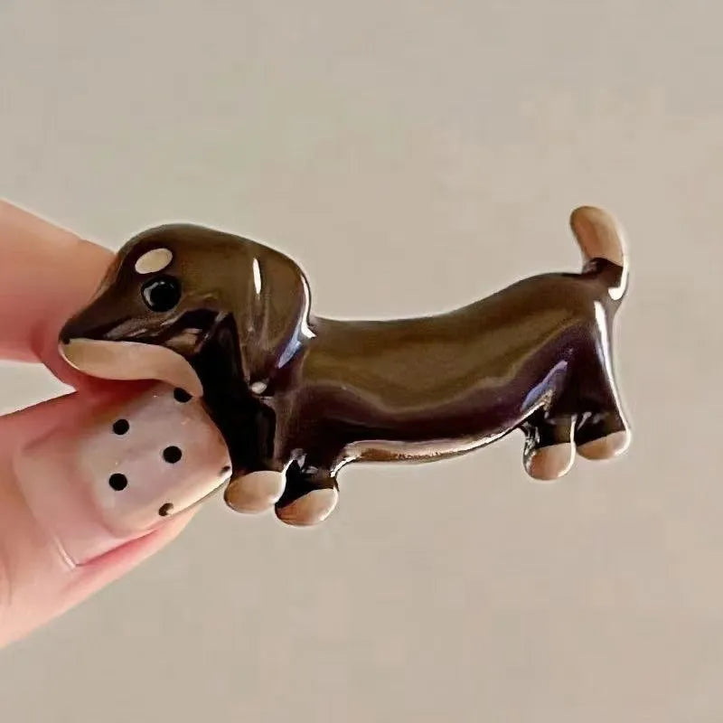 Cute dachshund dog design hair barrettes with an electroplated metallic finish.