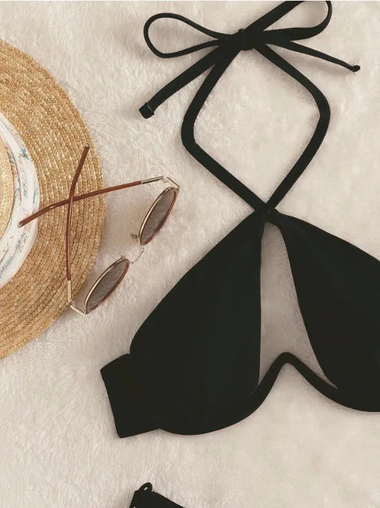 Brown women's halter-neck bikini top and briefs bottom on a mannequin.