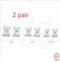 Geometric petal crystal flowers stud earrings in sterling silver with gold or platinum finish.