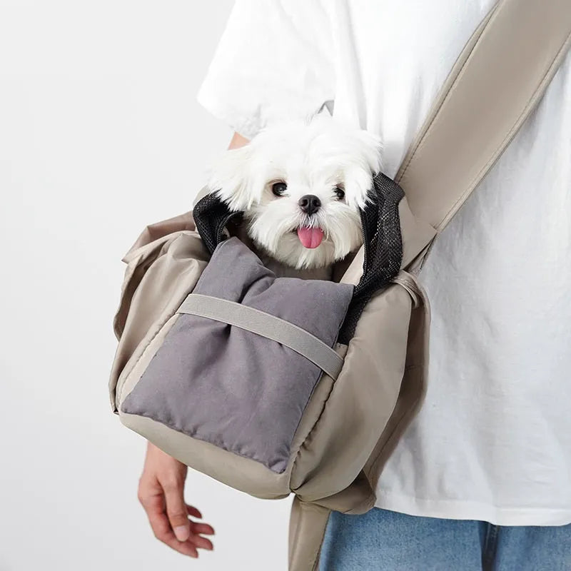 Apricot-colour cloth pet carrier handbag for small pets, showing single handle and rectangular shape.