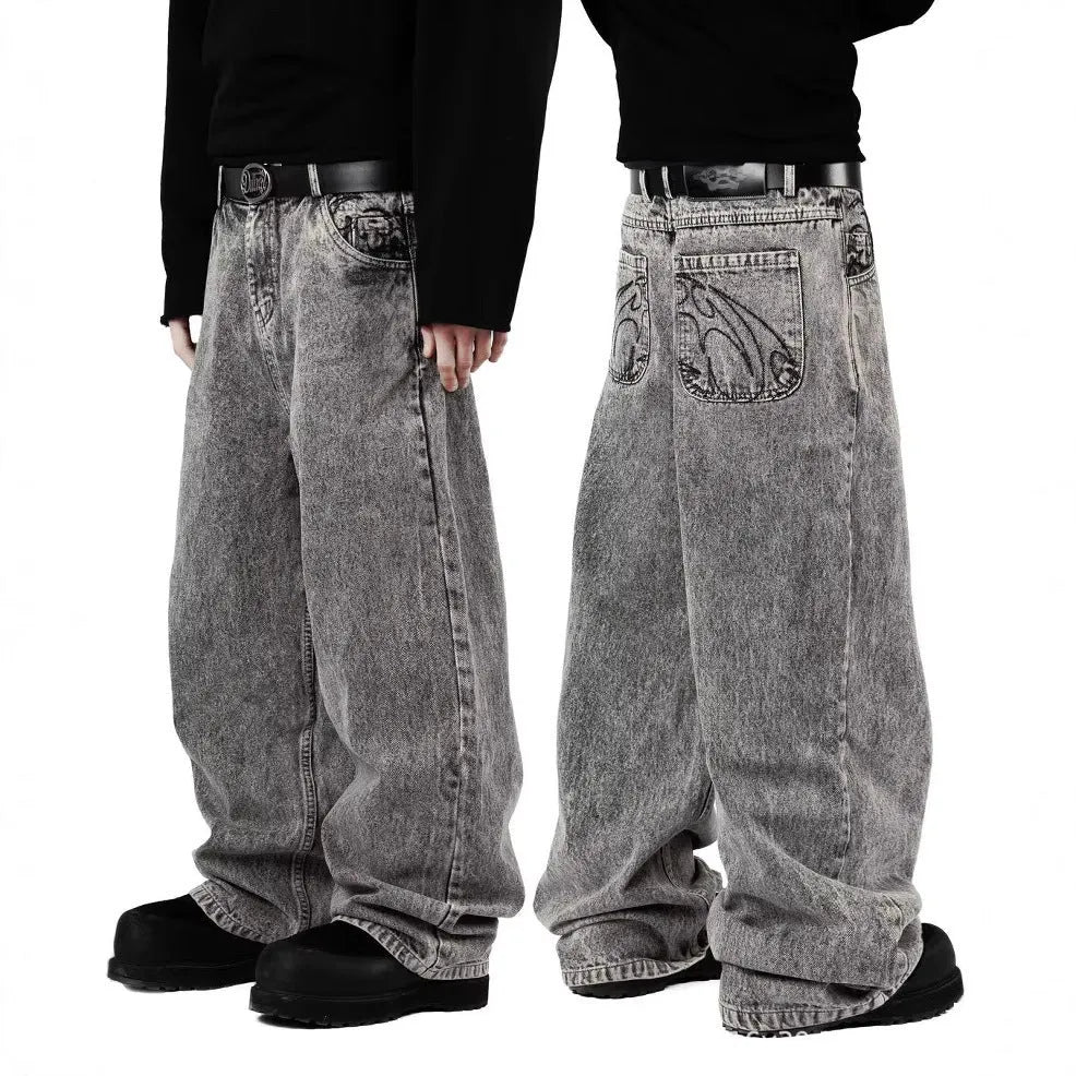 Grey loose straight-leg cotton denim trousers on a hanger, showing mid waist and straight leg cut.