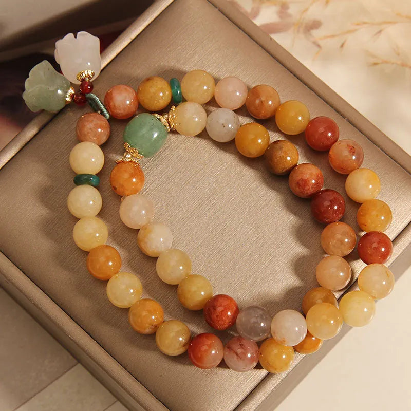 Natural jade multi-layer bracelet for women with a white orchid pendant charm on an elasticated cord