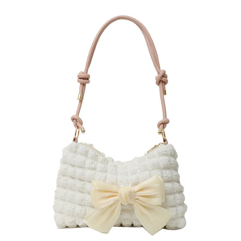 Women's canvas shoulder bag in horizontal square design with single strap and sandwich pockets