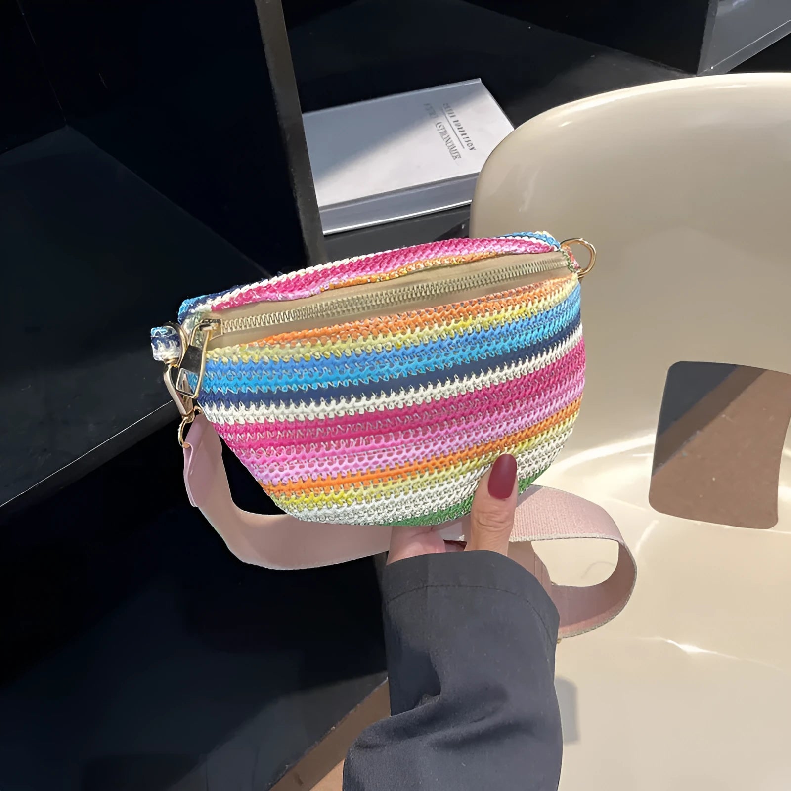 Straw woven beach bag with single shoulder strap and internal zipper compartment