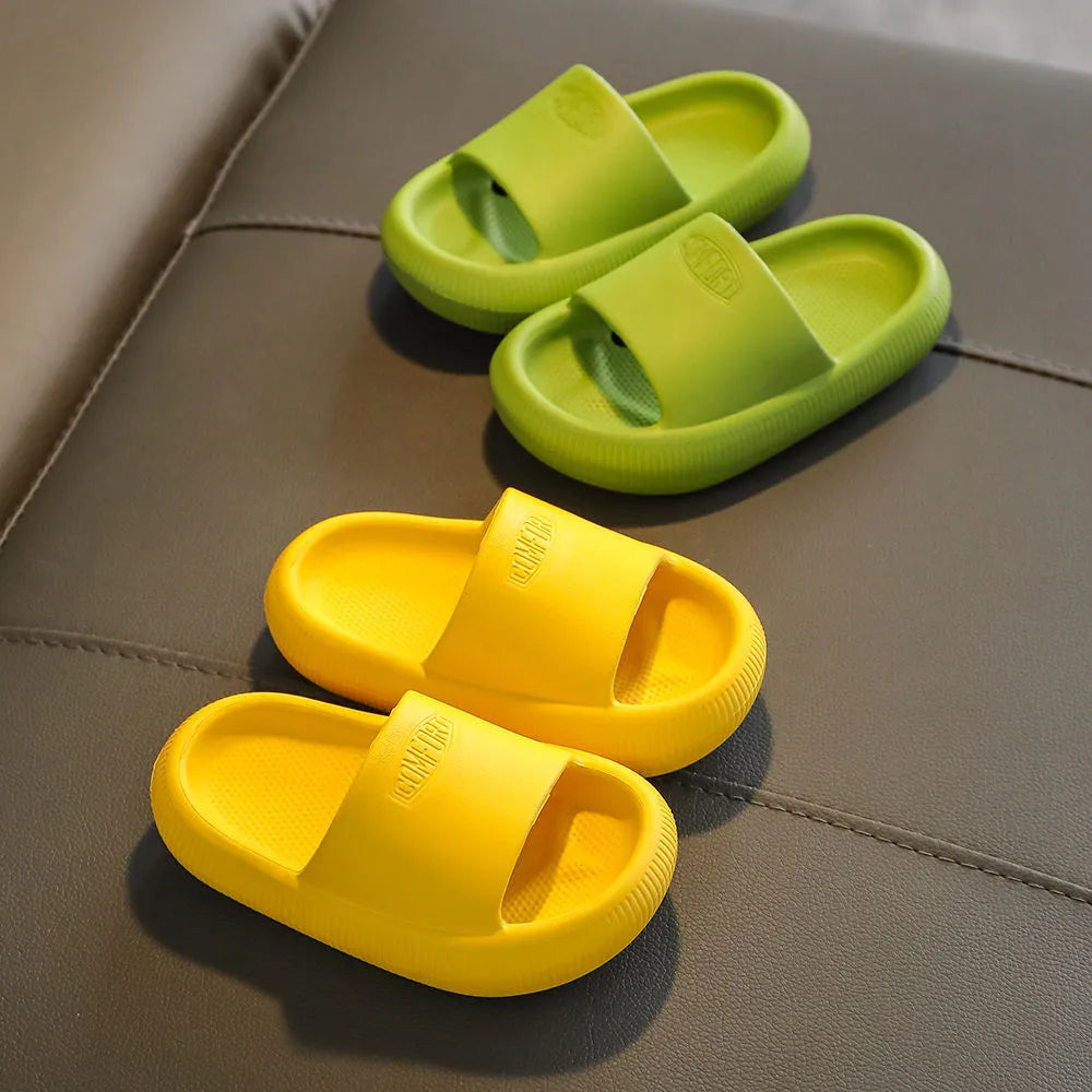 Children's EVA literal slippers with injection moulded soles in mixed colours showing non-slip wear-resistant design