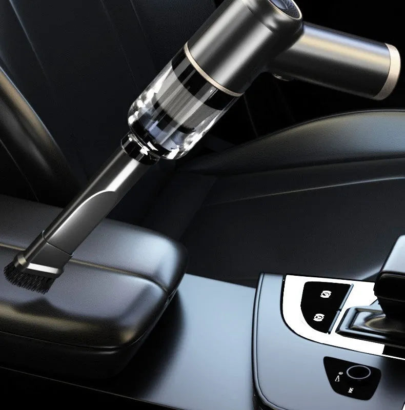 Black wireless car vacuum cleaner with multiple nozzle attachments including brushes and suction nozzles