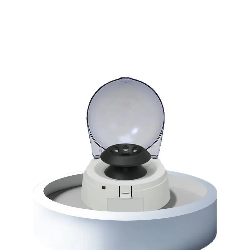 Mini laboratory centrifuge machine with compact 157x170x120mm dimensions on a benchtop.