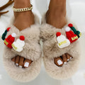 Women's Christmas slippers with a red and white hat decoration on the front, made from hairy plush fabric.