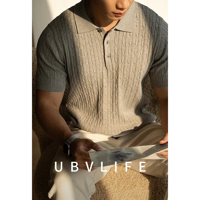 Men's khaki short-sleeve business top on a hanger, showing front design.