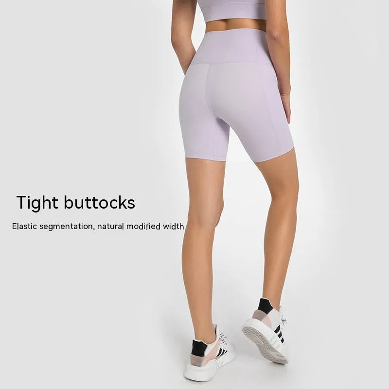 Women's black sport shorts with super stretch fabric and mid-thigh length.