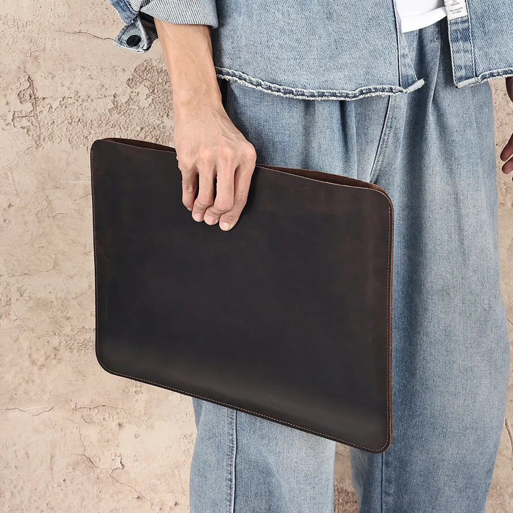 Brown crazy horse leather horizontal computer liner bag showing organisational compartments
