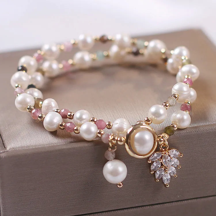 Women's double layer crystal bracelet with lucky cat charm and red cat's eye flowers design.