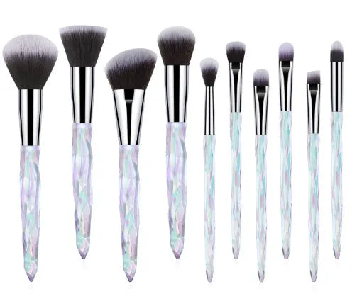 Set of 10 clear crystal handle foundation brushes with diamond shank design and synthetic bristles.