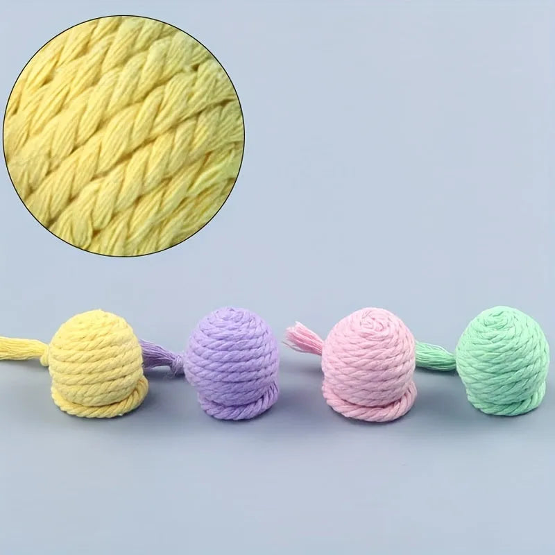 Colourful cat toy ball with rope handle and internal bell in small and medium sizes