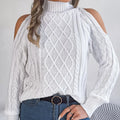 Woman wearing a grey twisted strapless sweater with half-high collar and lantern sleeves.