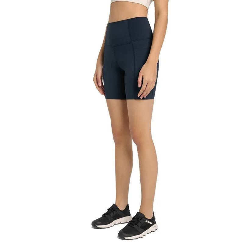 Women's black sport shorts with super stretch fabric and mid-thigh length.