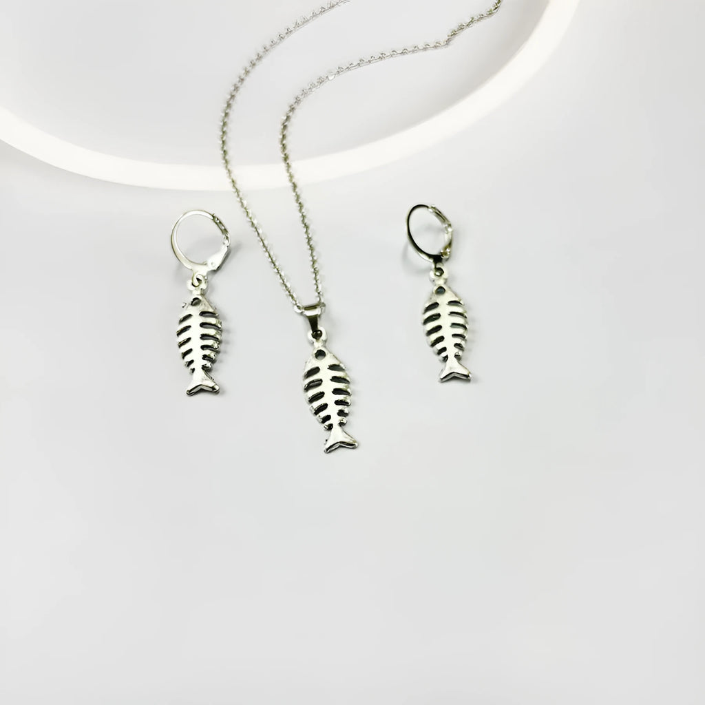 Fishbone pendant earrings and matching necklace set with adjustable chain on grey background