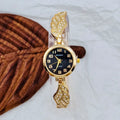 Women's stainless steel watch with round dial on wrist, showing gold face colour option and vachette clasp.