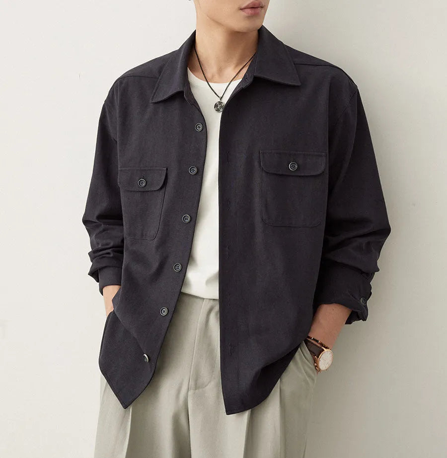 Men's simple profile cotton lapel shirt in light sand rice colour, showing long sleeves and collar detail.