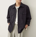 Men's simple profile cotton lapel shirt in light sand rice colour, showing long sleeves and collar detail.