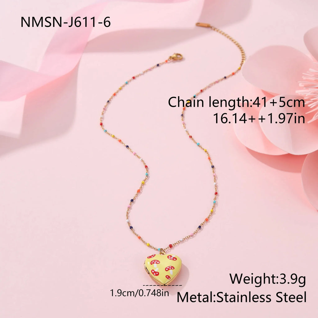 Gold plated fruit charm necklace with heart-shaped pendant on adjustable stainless steel chain