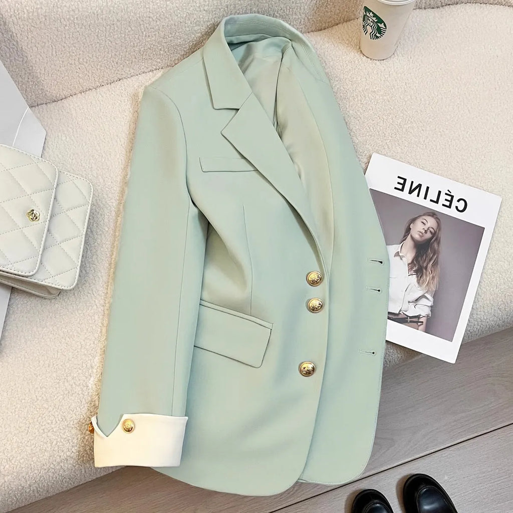 Women's loose fit Korean style trench coat in milky white with pocket detailing