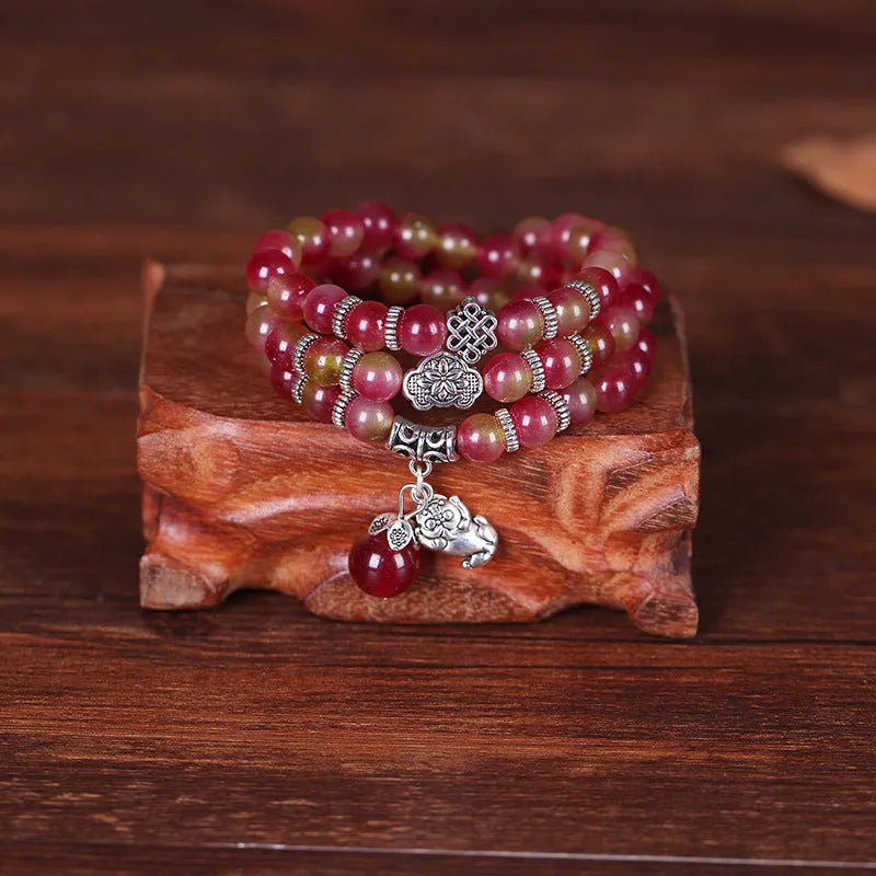 Handmade Chinese knot bracelet with natural watermelon crystal beads in traditional design
