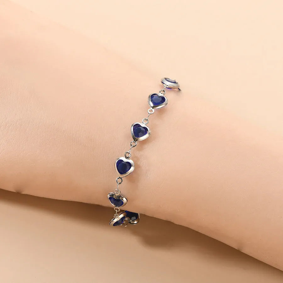 Devil's Eye creative heart stainless steel bracelet in colourful, royal blue, dark green, red, light green, and light blue options