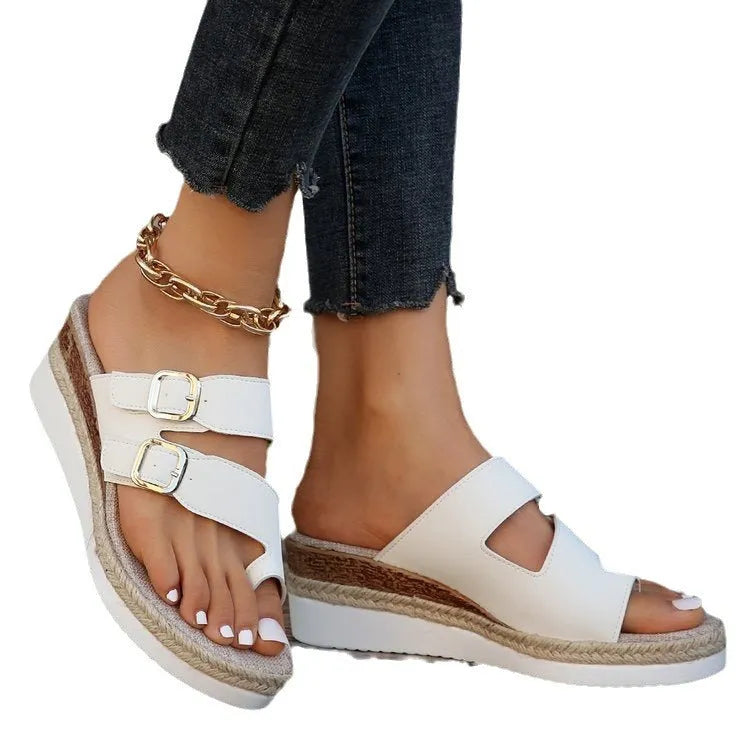 White women's woven patent leather wedge sandals with finger-fit design and peep toe.