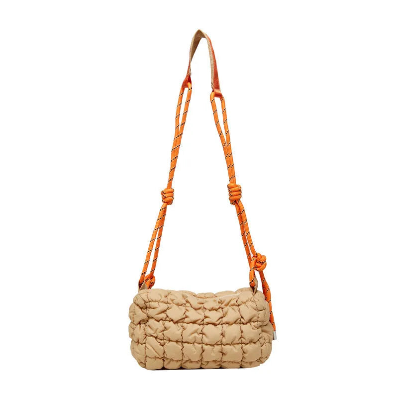 Soft nylon women's crossbody messenger bag in pillow shape with a rhombus pattern and a zippered inner pocket.