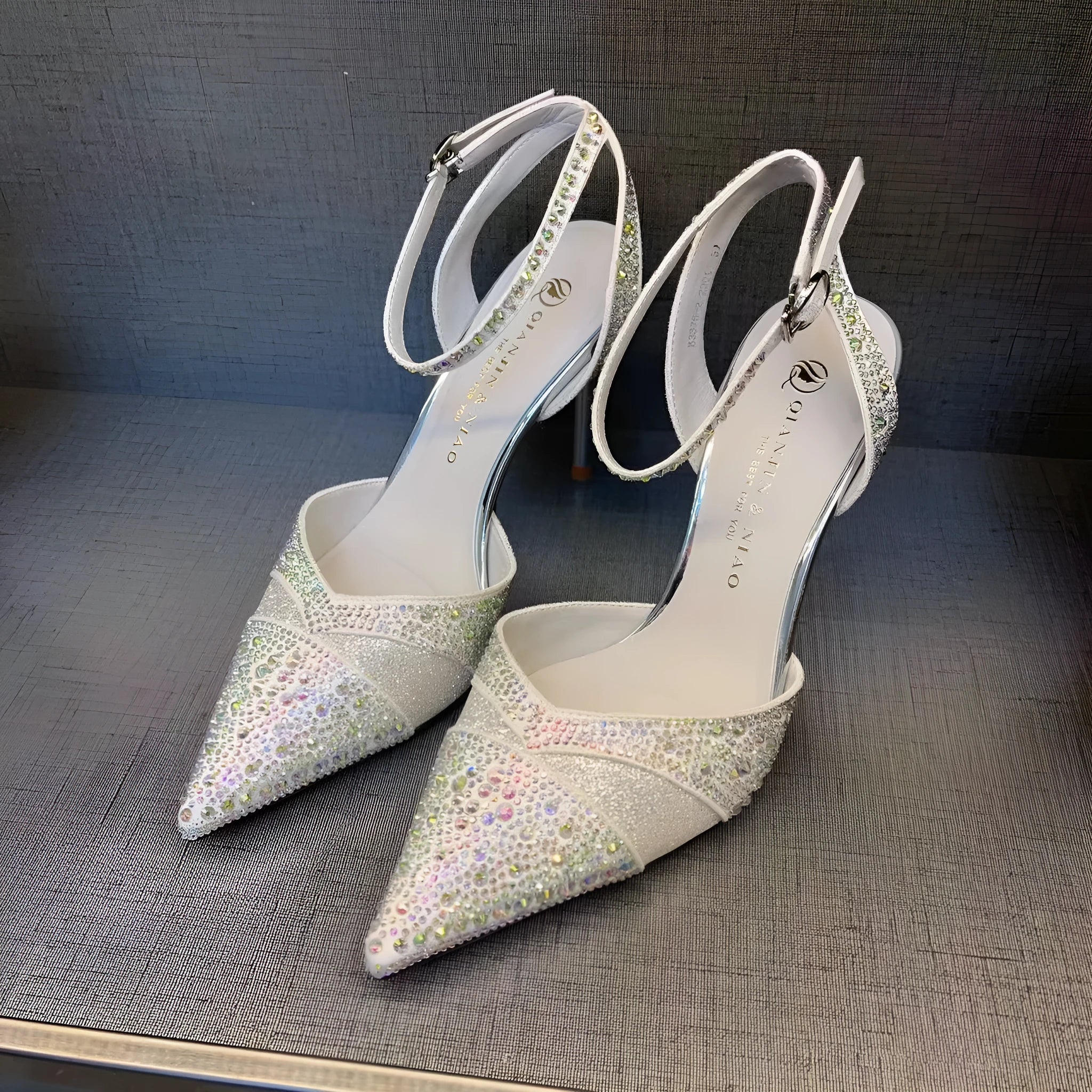 Women's hollow high heels with red sole and stiletto heel in black or silver colours