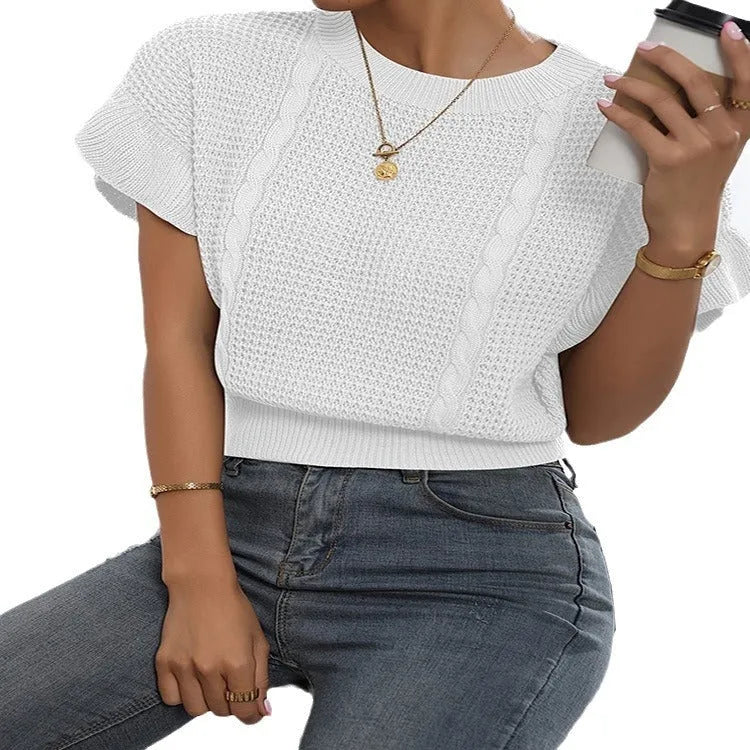 Knitted pullover sweater with ruffled short sleeves and a textured 3D pattern in a loose fit.