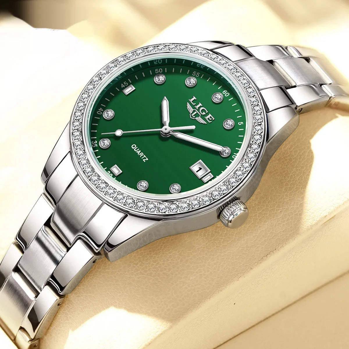 Silver fashion quartz watch with diamond-encrusted round dial and stainless steel case on wrist.