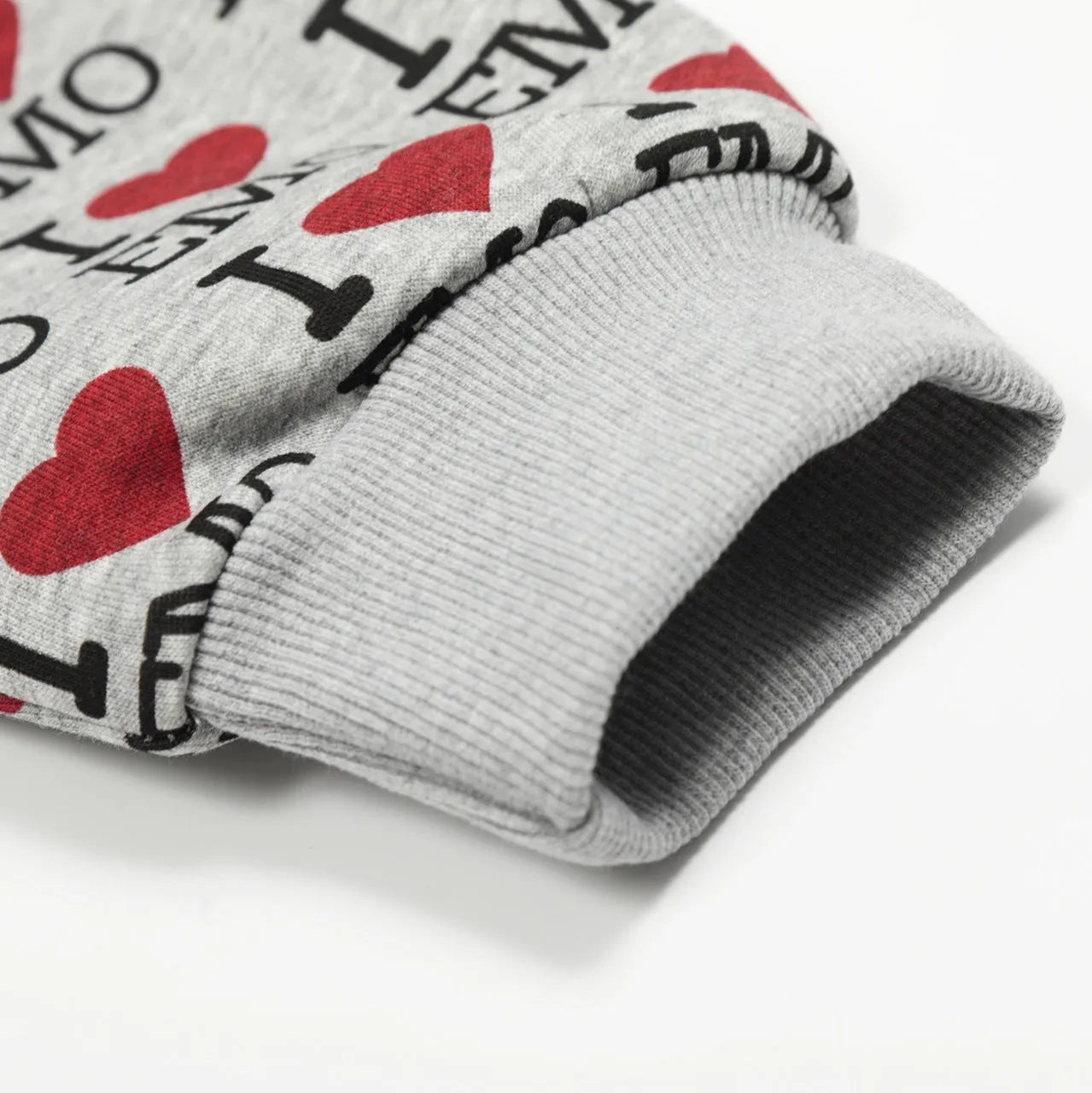 Women's grey cotton hooded cardigan sweater with a retro autumn pattern, shown in a street-fashion style.