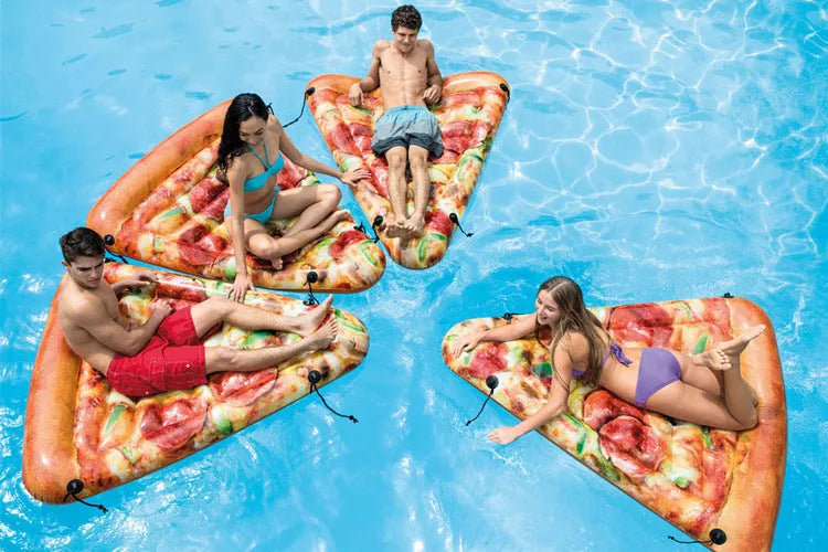 Large red and yellow inflatable pizza slice on a surfboard design, floating on water.