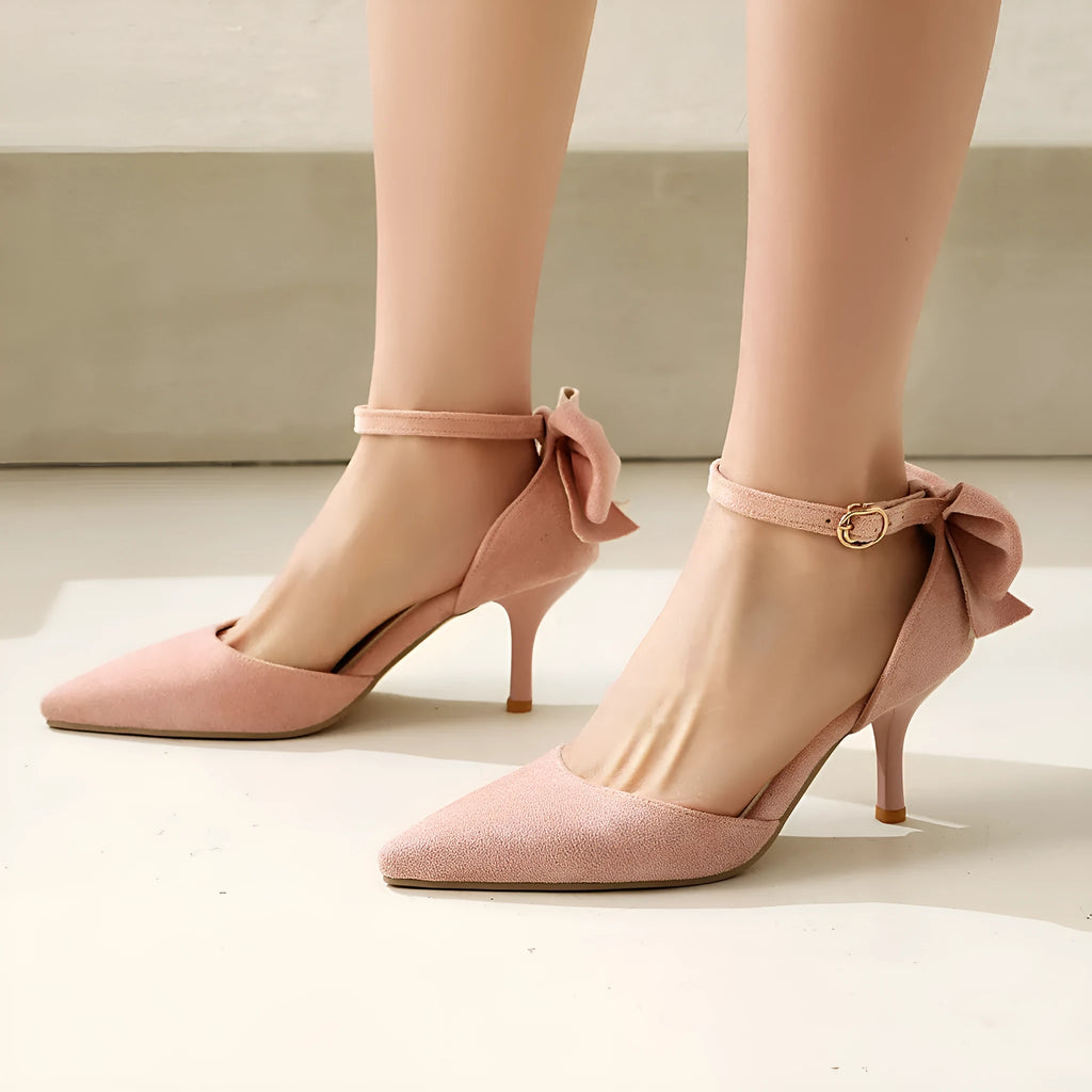 Pointed-toe stiletto high heels with a bowknot on suede upper.