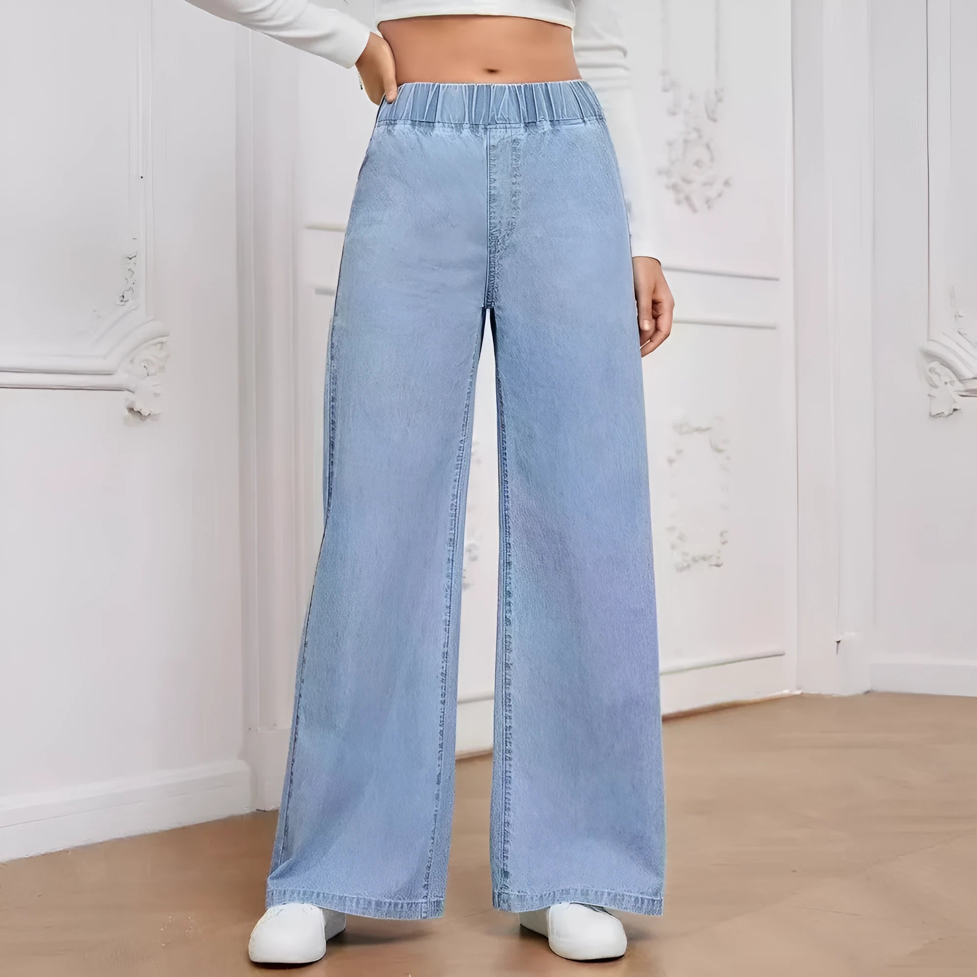 Light blue washed wide-leg straight cut jeans with mid-waist fit and zip fly opening