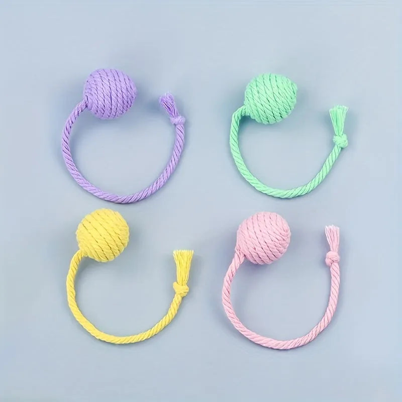 Colourful cat toy ball with rope handle and internal bell in small and medium sizes