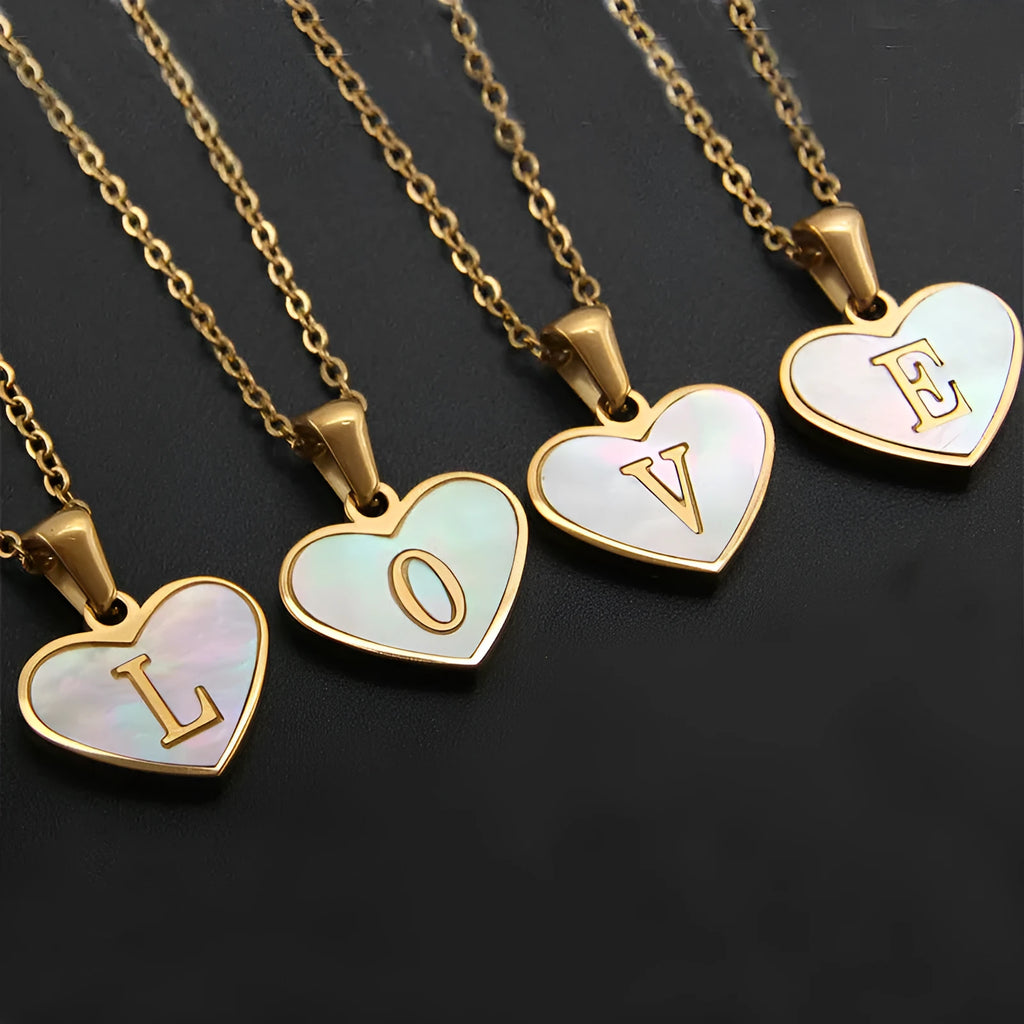 Gold plated heart necklace with white shell detail on an adjustable chain