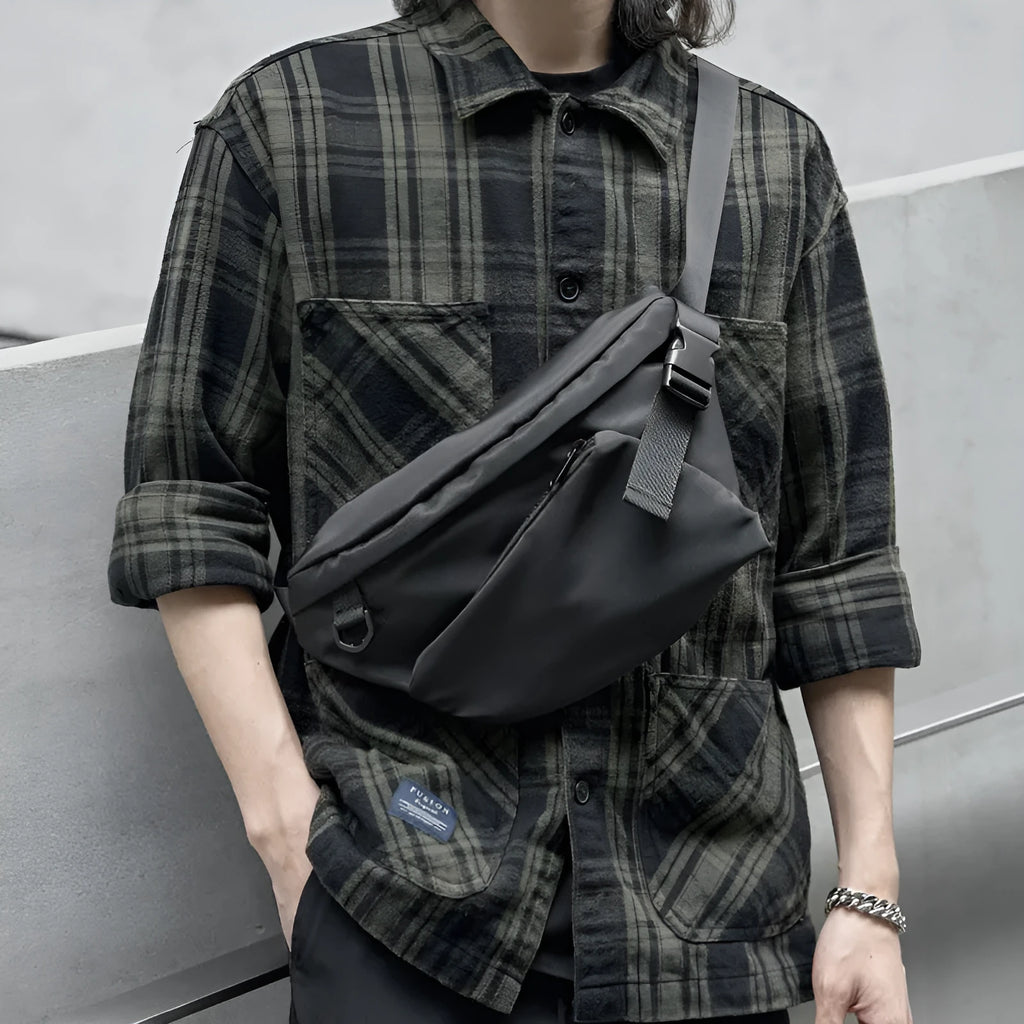 Black men's slanted chest bag in Oxford fabric with 8-inch dimensions and visible sewing lines
