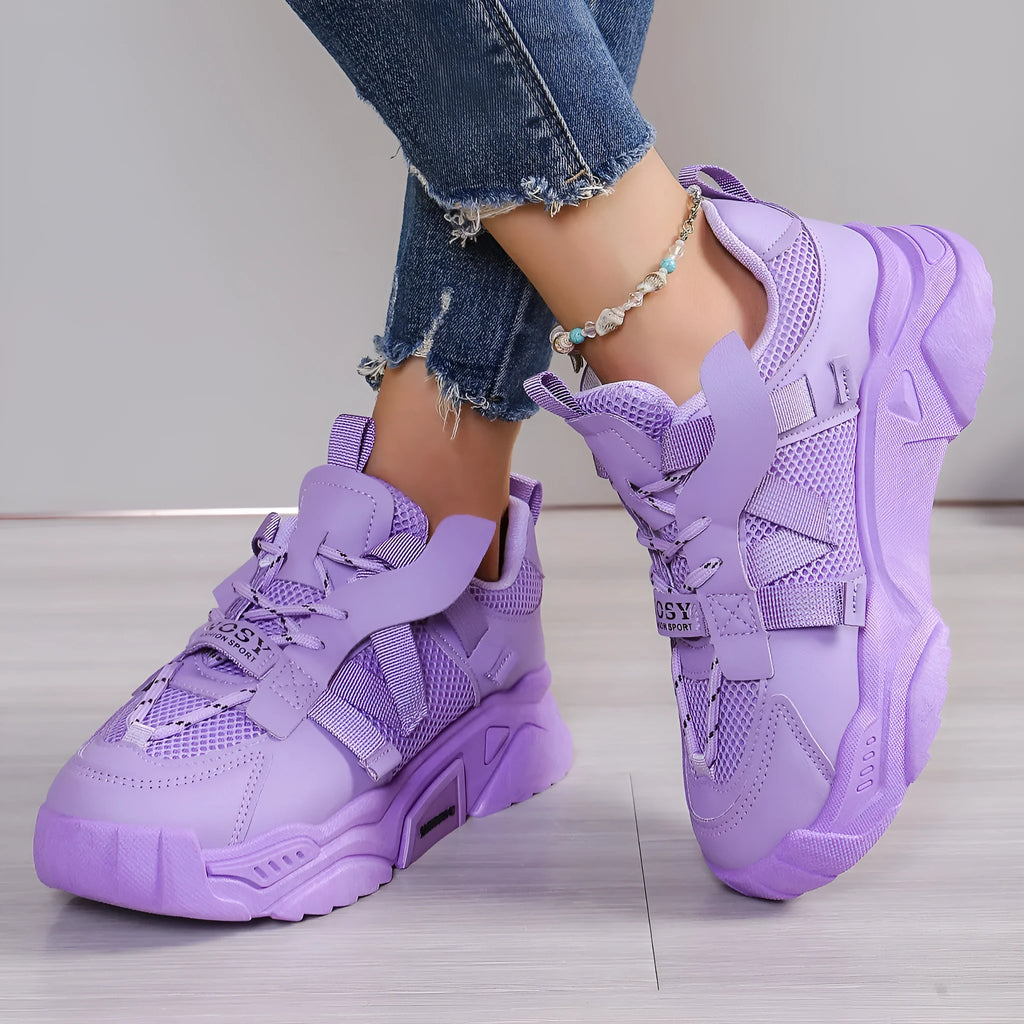 Women's purple platform mesh sneakers with lace-up front on wooden floor
