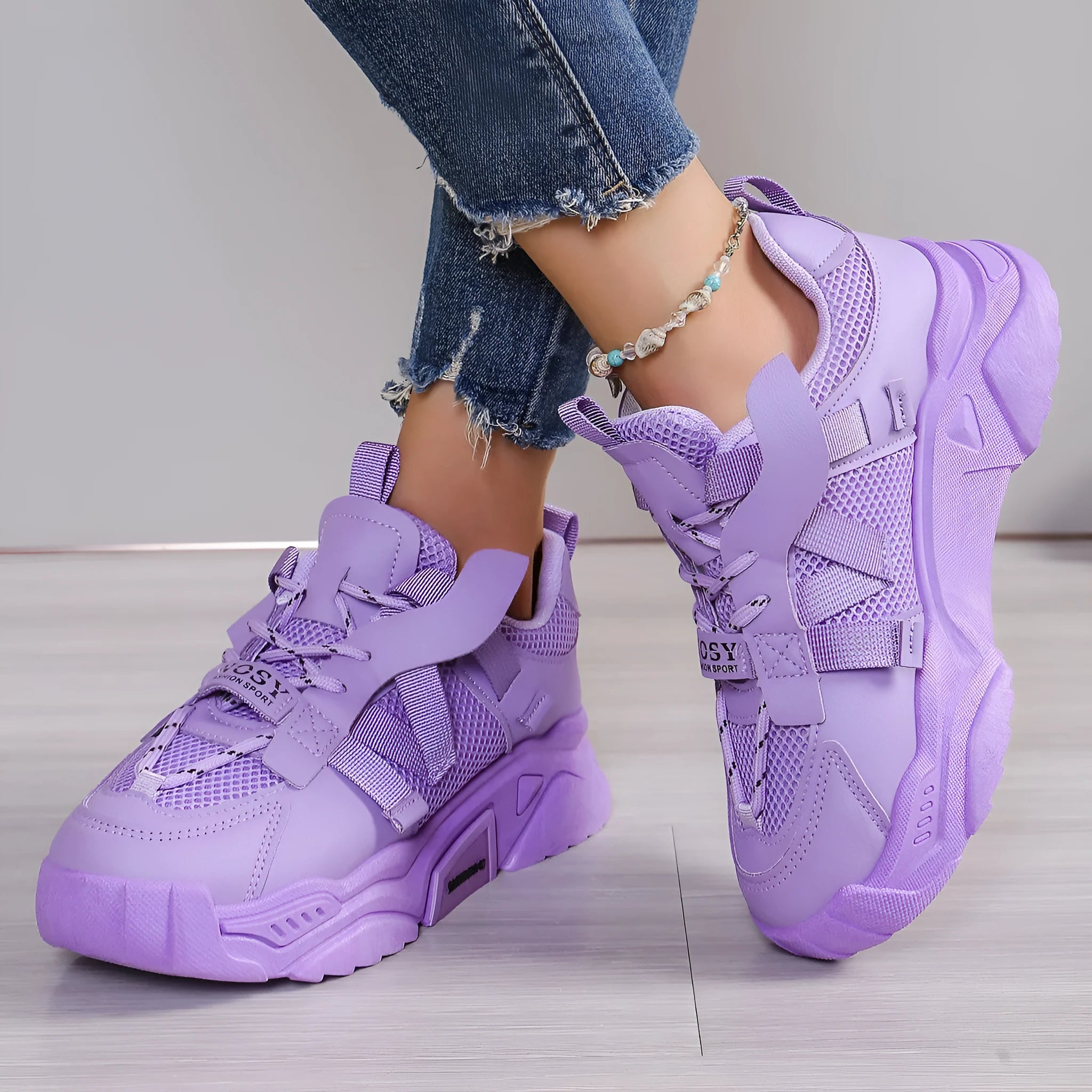 Women's purple platform mesh sneakers with lace-up front on wooden floor
