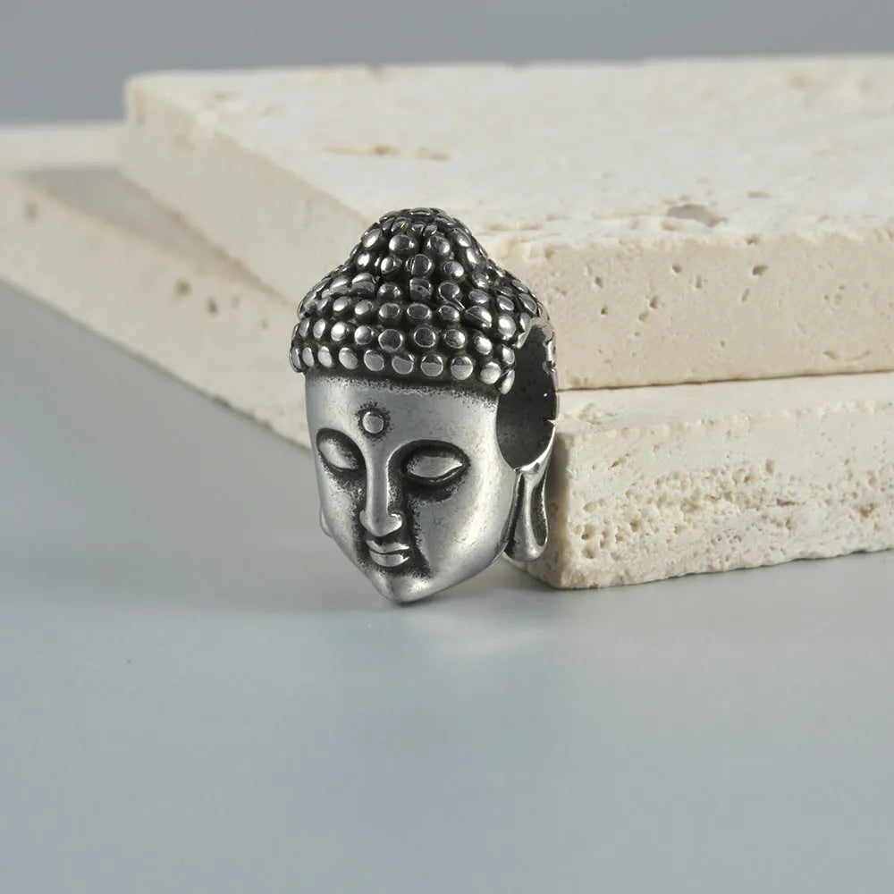 Stainless steel hollow skull Buddha earrings in geometric design with electroplated colour finish