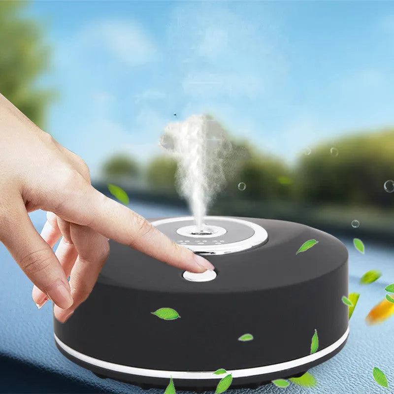 White plastic USB car aromatherapy machine with anti-slip pad on vehicle dashboard