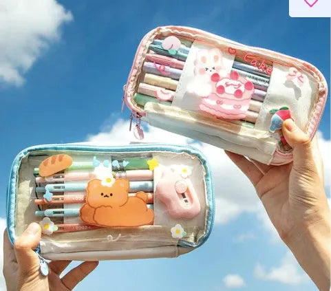 Transparent TPU pencil case with Korean-style pink rabbit design showing visible pens inside