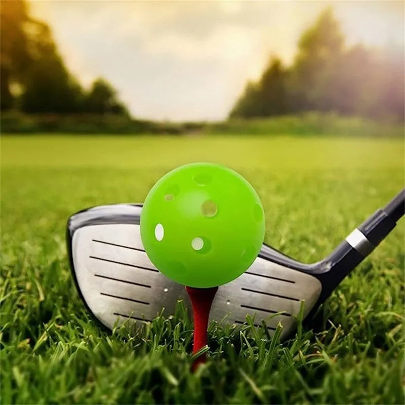 Multi-colour golf practice balls in red, orange, blue, green, white, and yellow packed in a net bag.