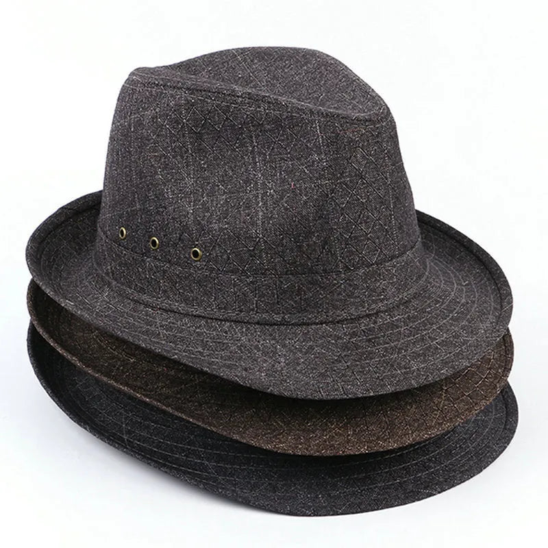 Classic brown suit material fedora hat for men on a grey background.