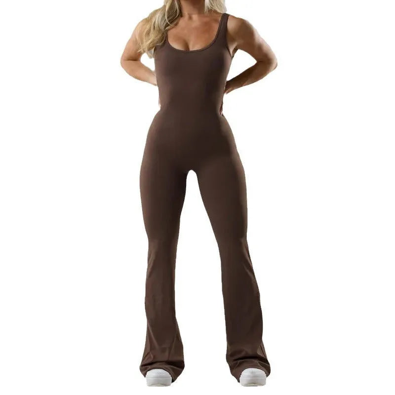 Women's tight black yoga bodysuit with seamless hollow design and trousers length.